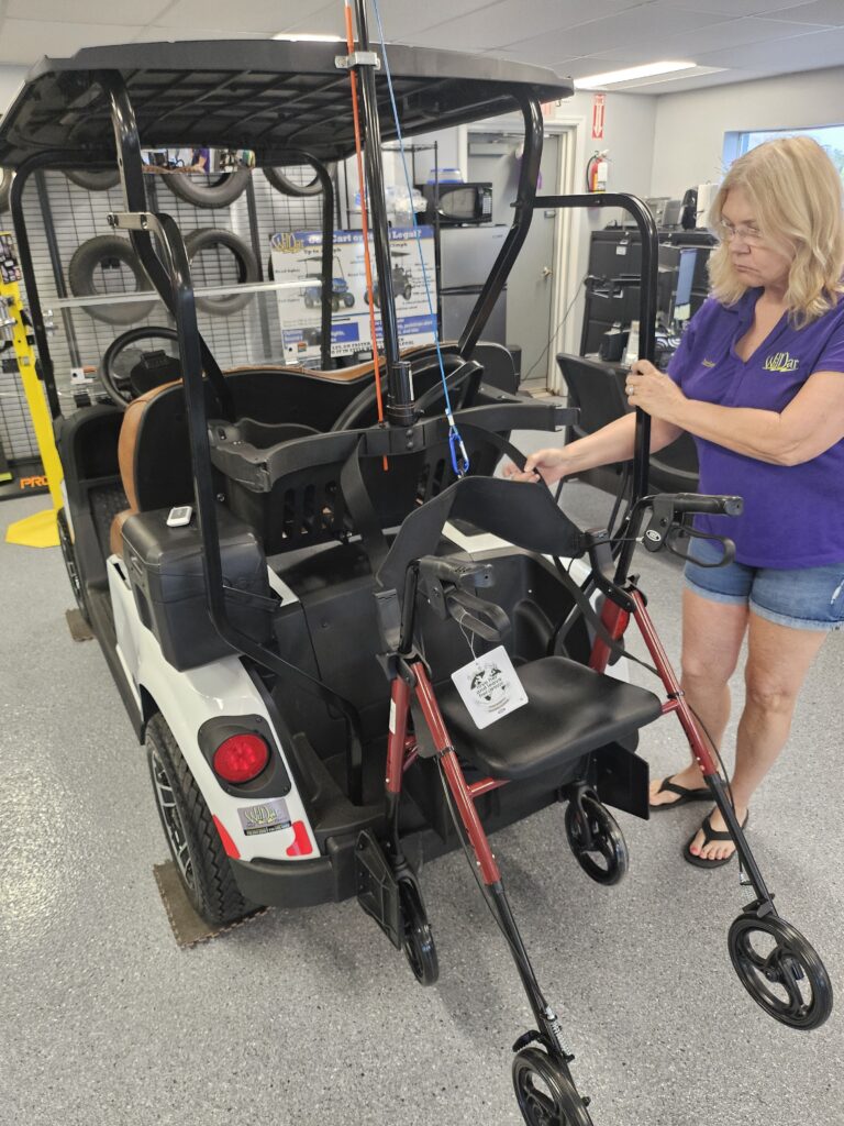 Secure walker to mobility golf cart with sure grip of a safety grab bar.
