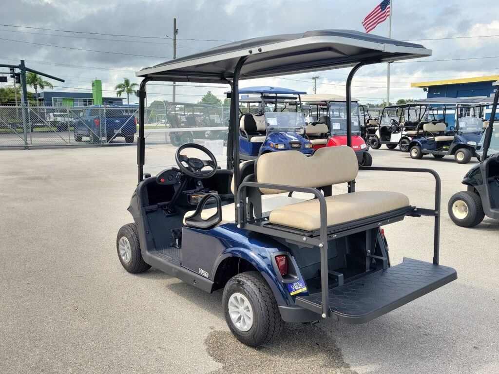 Rear three-quarter view of a refurbished E-Z-GO RXV on the WilDar lot